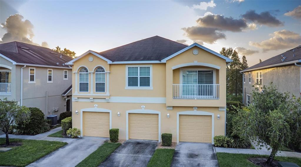 9013 Moonlit Meadows Loop Riverview, FL 33578 - Photo 2 of 43 a front view of a house with a yard and garage