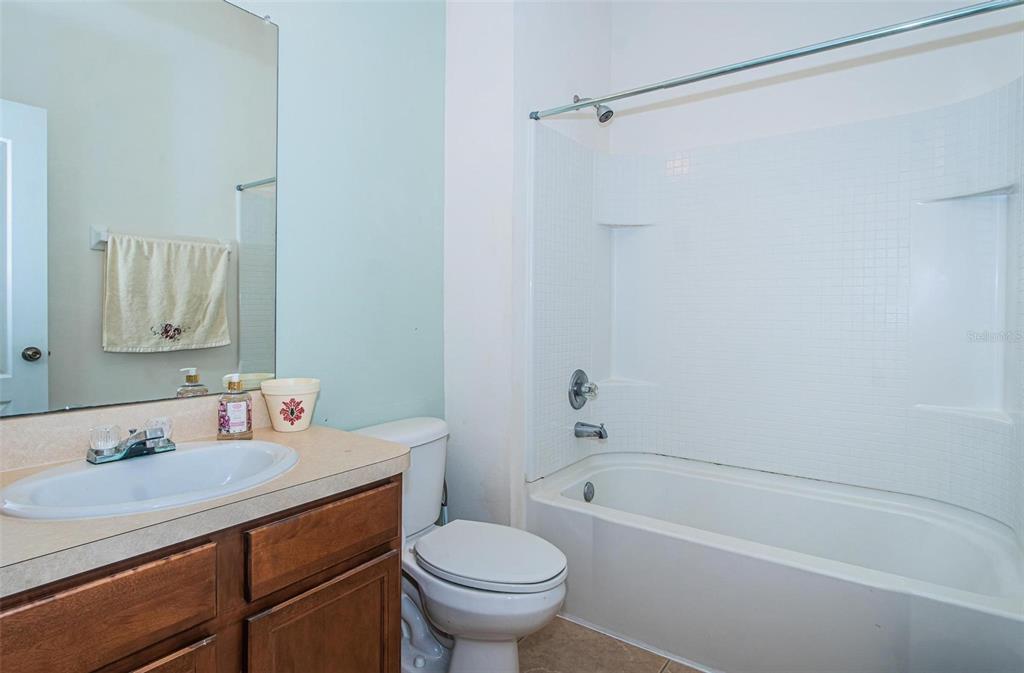 9013 Moonlit Meadows Loop Riverview, FL 33578 - Photo 21 of 43 a bathroom with a sink toilet and shower