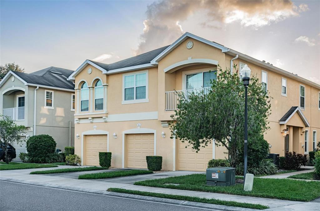 9013 Moonlit Meadows Loop Riverview, FL 33578 - Photo 4 of 43 a front view of a house with a yard