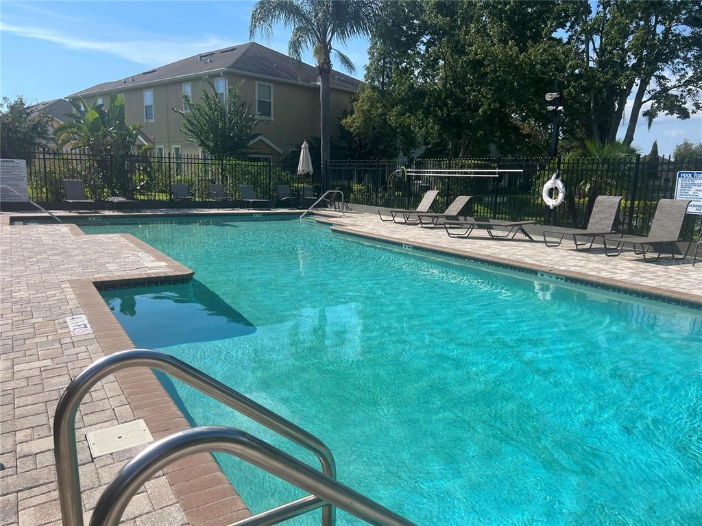 9013 Moonlit Meadows Loop Riverview, FL 33578 - Photo 42 of 43 a view of swimming pool with outdoor seating and yard