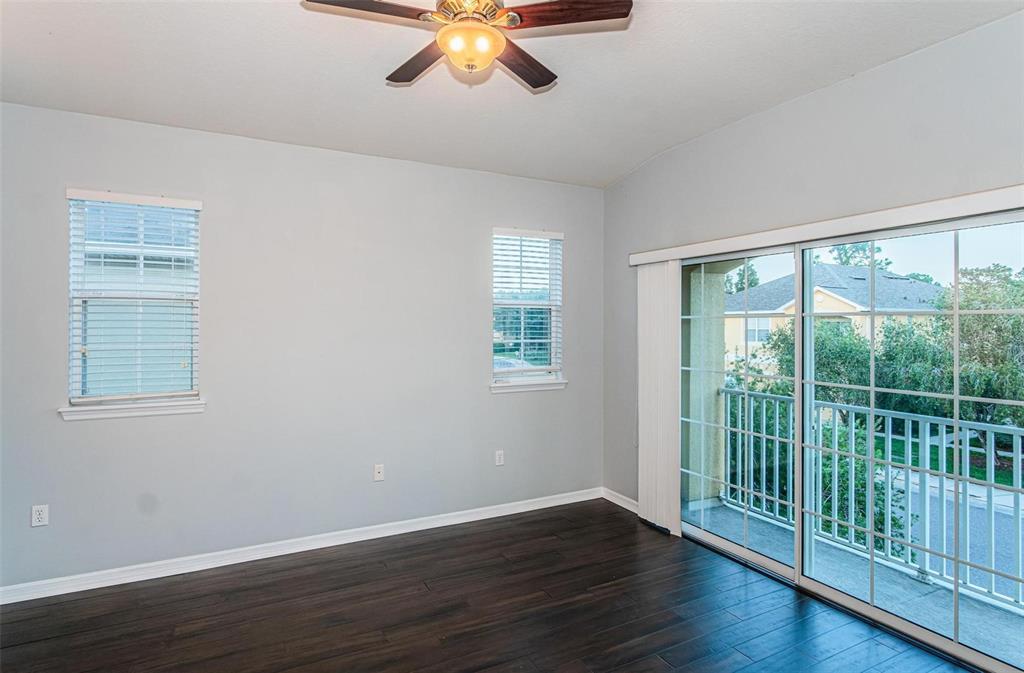 9013 Moonlit Meadows Loop Riverview, FL 33578 - Photo 5 of 43 a view of a room with wooden floor and balcony
