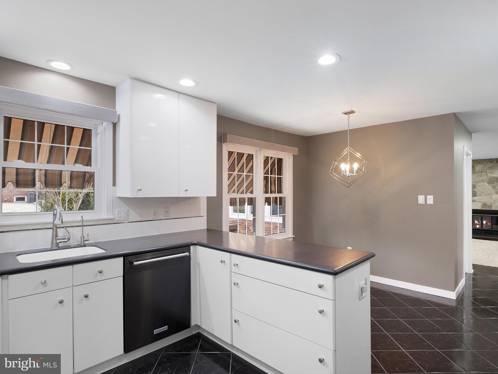 2 Windy Road Wilmington, DE 19810 - Photo 13 of 49 a kitchen with granite countertop white cabinets and white appliances