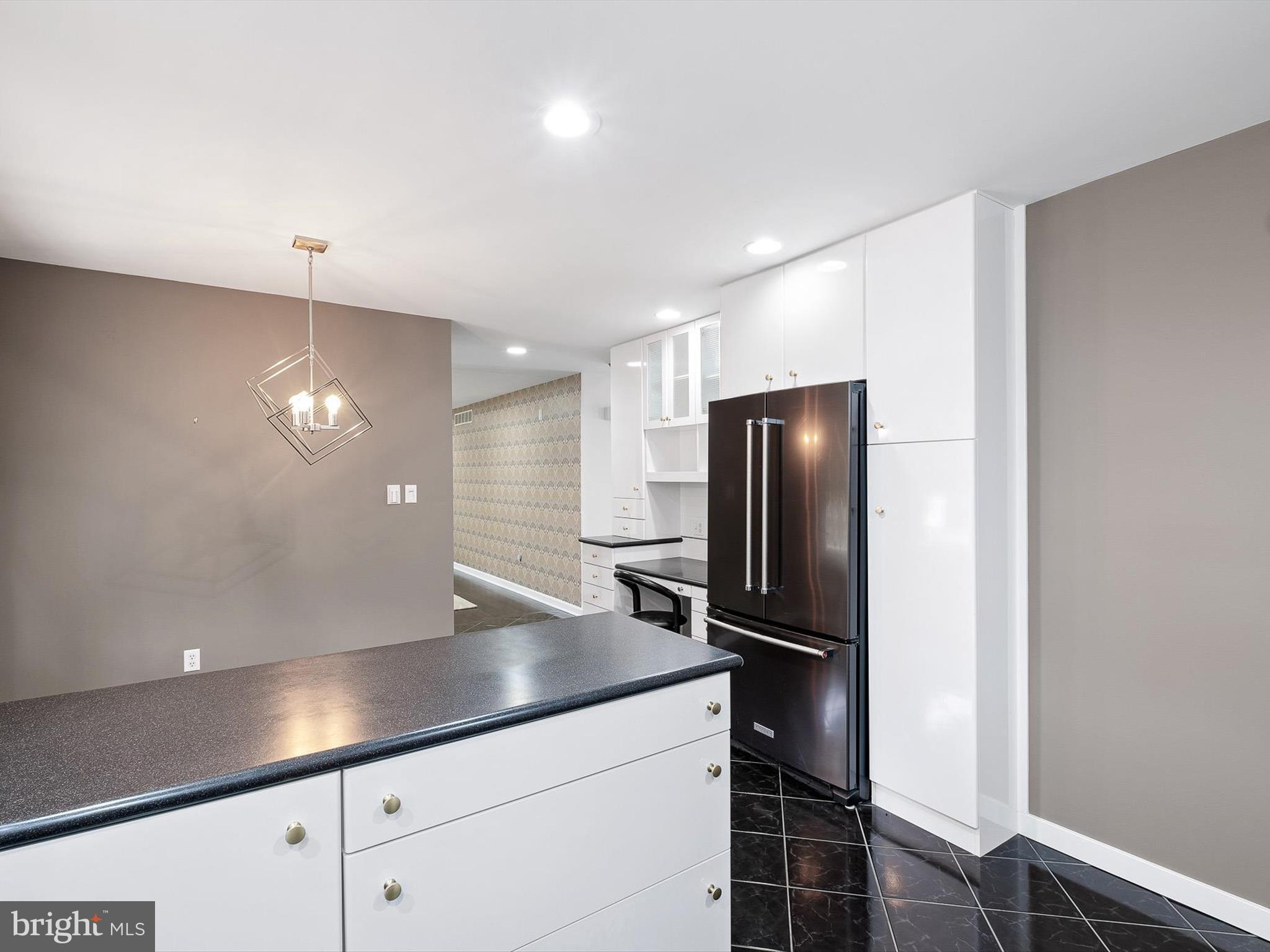 2 Windy Road Wilmington, DE 19810 - Photo 14 of 49 a kitchen with a refrigerator and microwave