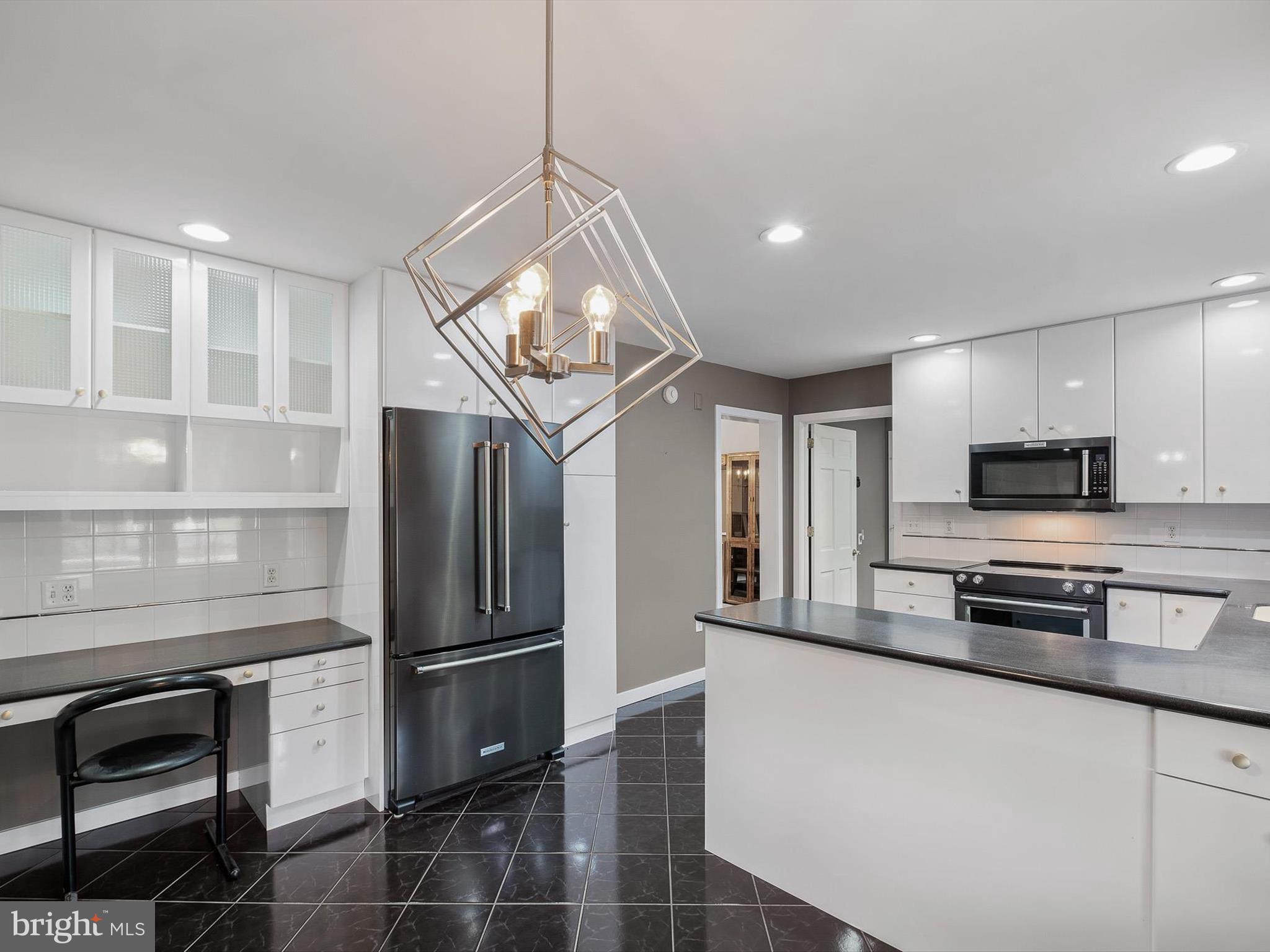 2 Windy Road Wilmington, DE 19810 - Photo 15 of 49 a kitchen with stainless steel appliances a refrigerator stove and microwave