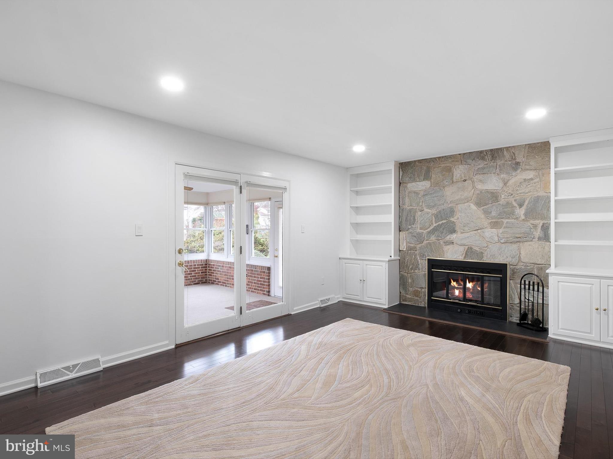 2 Windy Road Wilmington, DE 19810 - Photo 18 of 49 a view of an empty room with a fireplace and window
