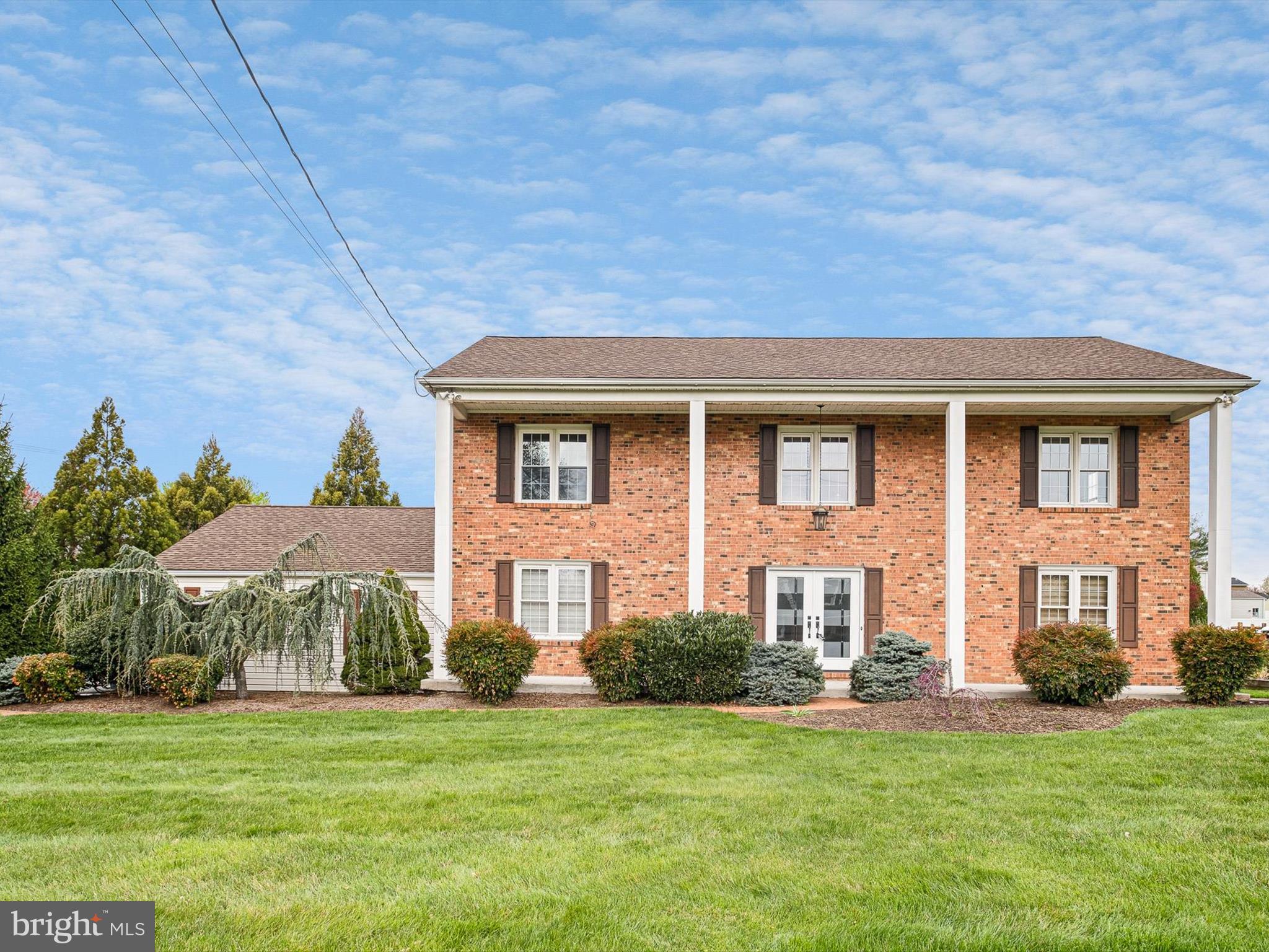 2 Windy Road Wilmington, DE 19810 - Photo 2 of 49 a front view of a house with a garden