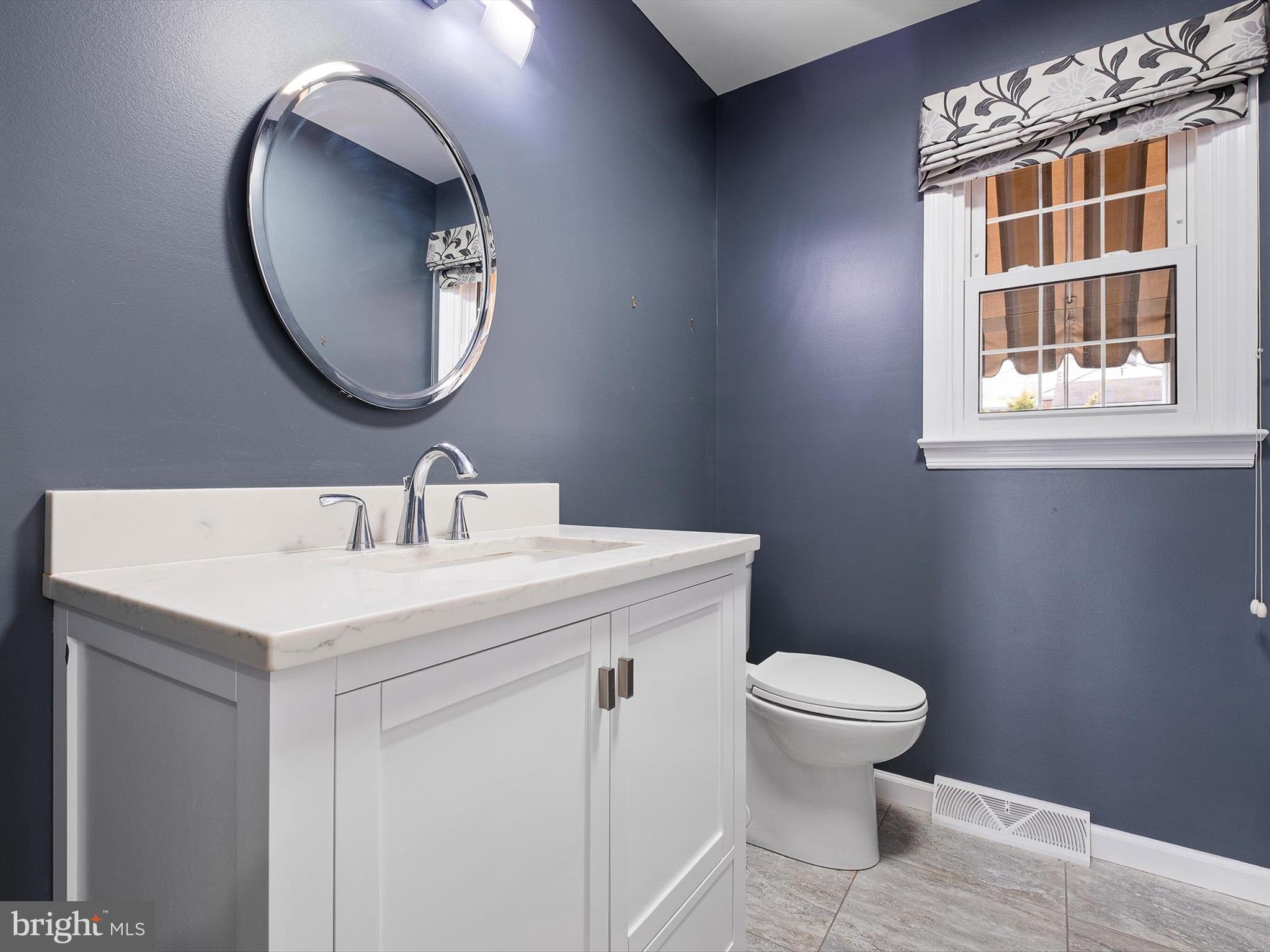 2 Windy Road Wilmington, DE 19810 - Photo 21 of 49 a bathroom with a toilet sink and mirror