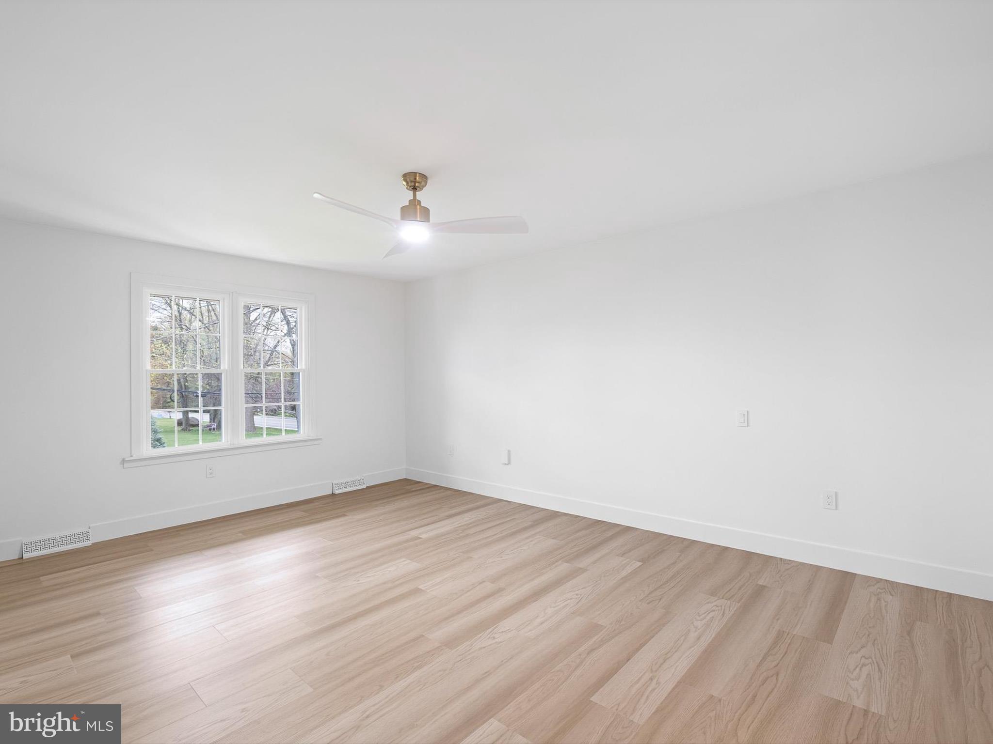2 Windy Road Wilmington, DE 19810 - Photo 25 of 49 wooden floor in an empty room with a window
