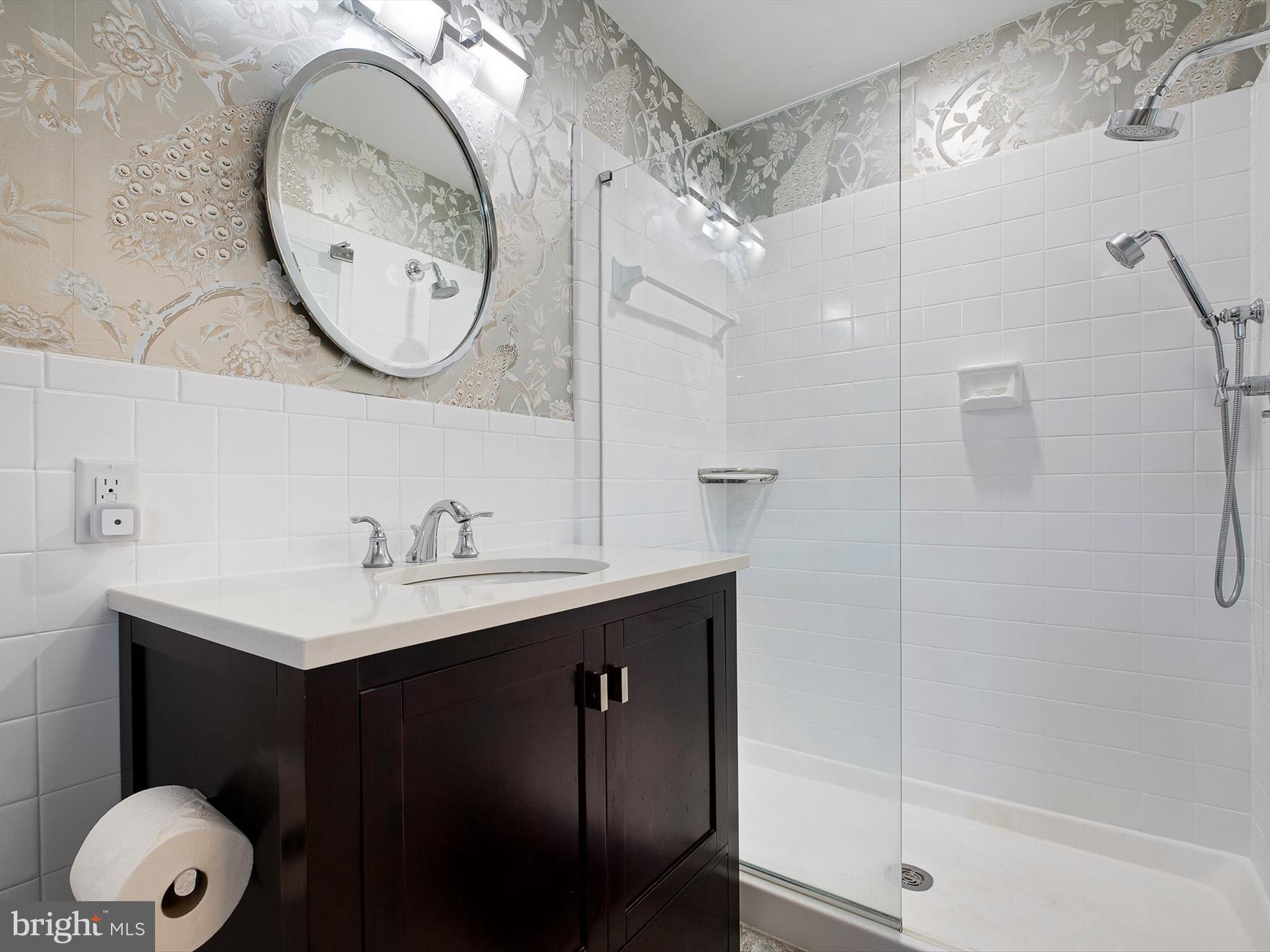 2 Windy Road Wilmington, DE 19810 - Photo 30 of 49 a bathroom with a sink and a mirror