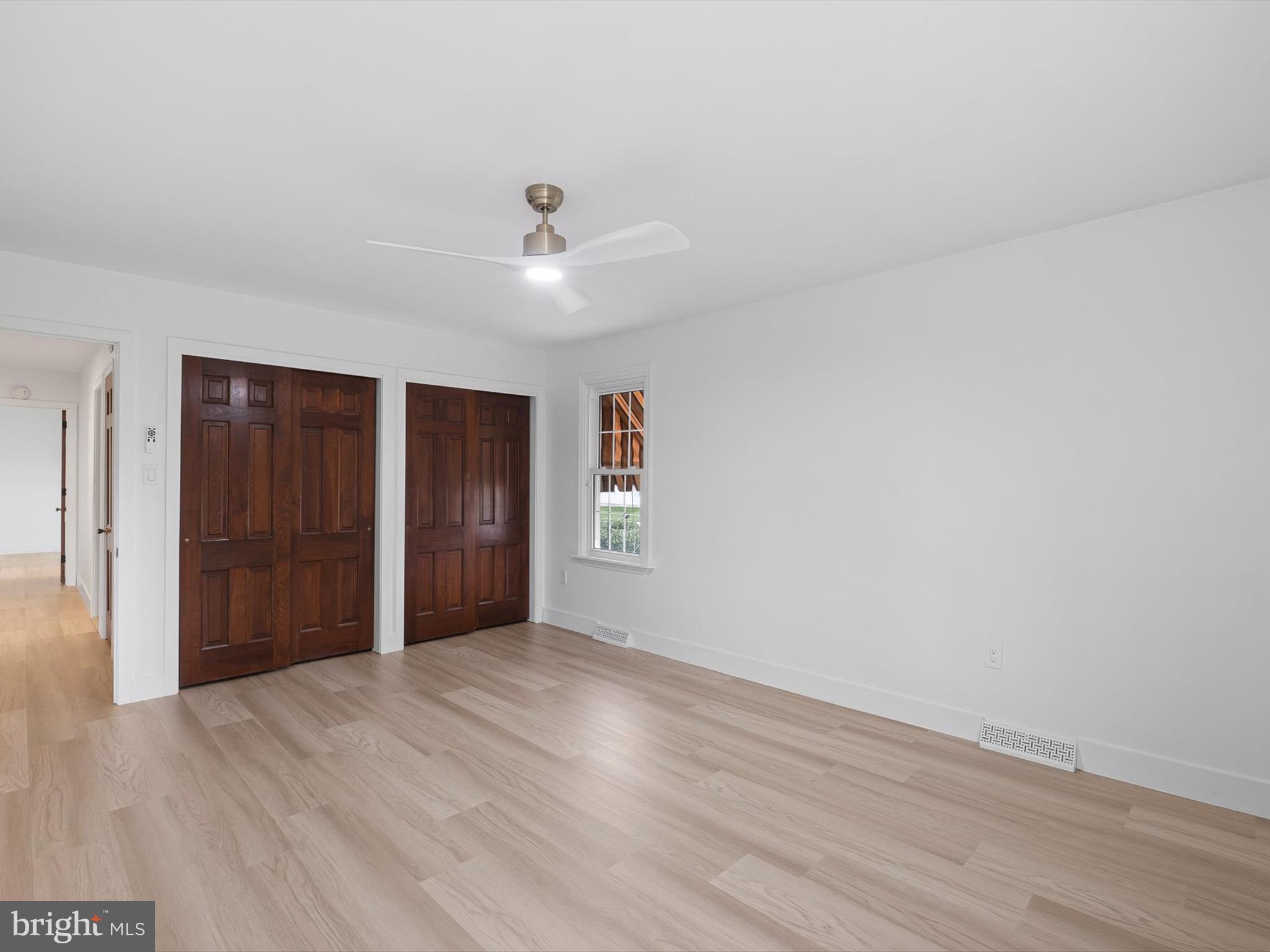 2 Windy Road Wilmington, DE 19810 - Photo 32 of 49 a view of empty room with wooden floor and ceiling fan