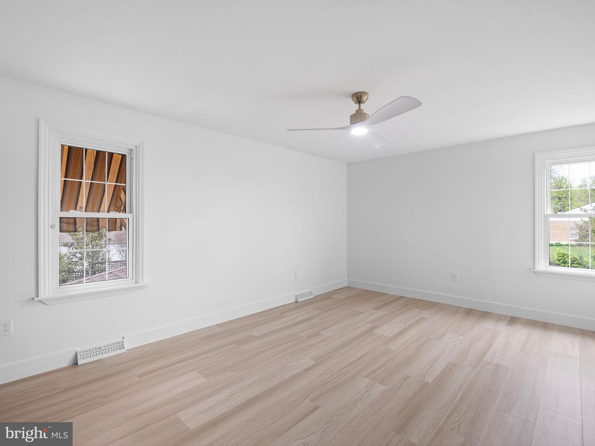 2 Windy Road Wilmington, DE 19810 - Photo 33 of 49 a view of an empty room with wooden floor and a window
