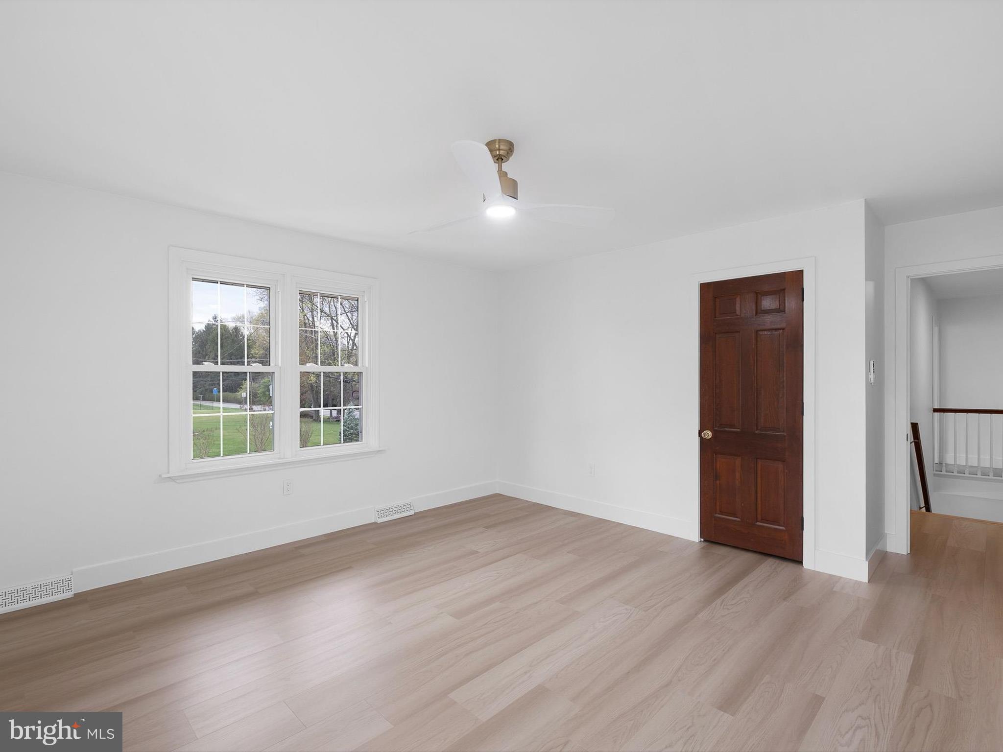 2 Windy Road Wilmington, DE 19810 - Photo 34 of 49 an empty room with wooden floor and windows
