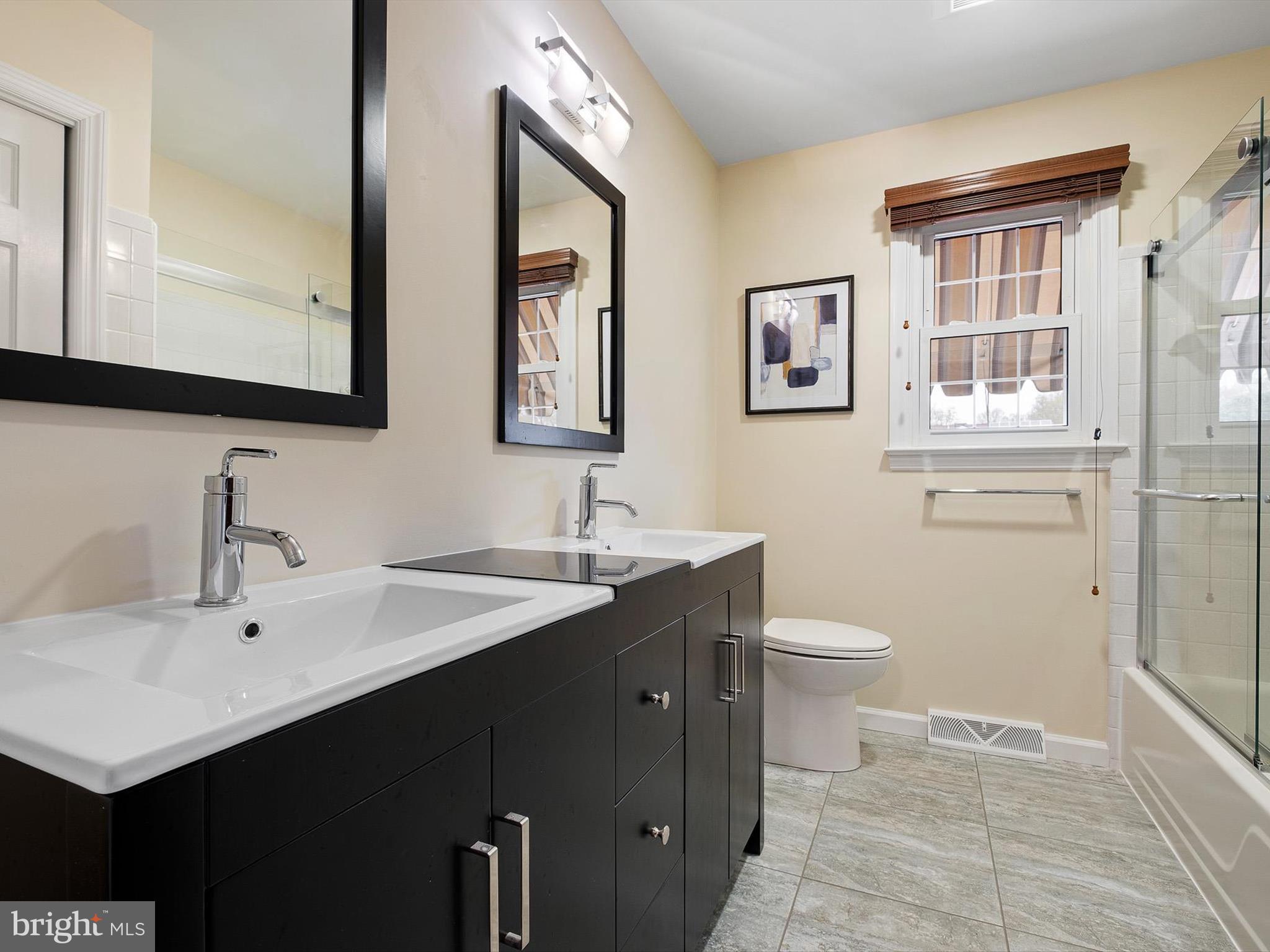 2 Windy Road Wilmington, DE 19810 - Photo 38 of 49 a bathroom with a sink and a mirror