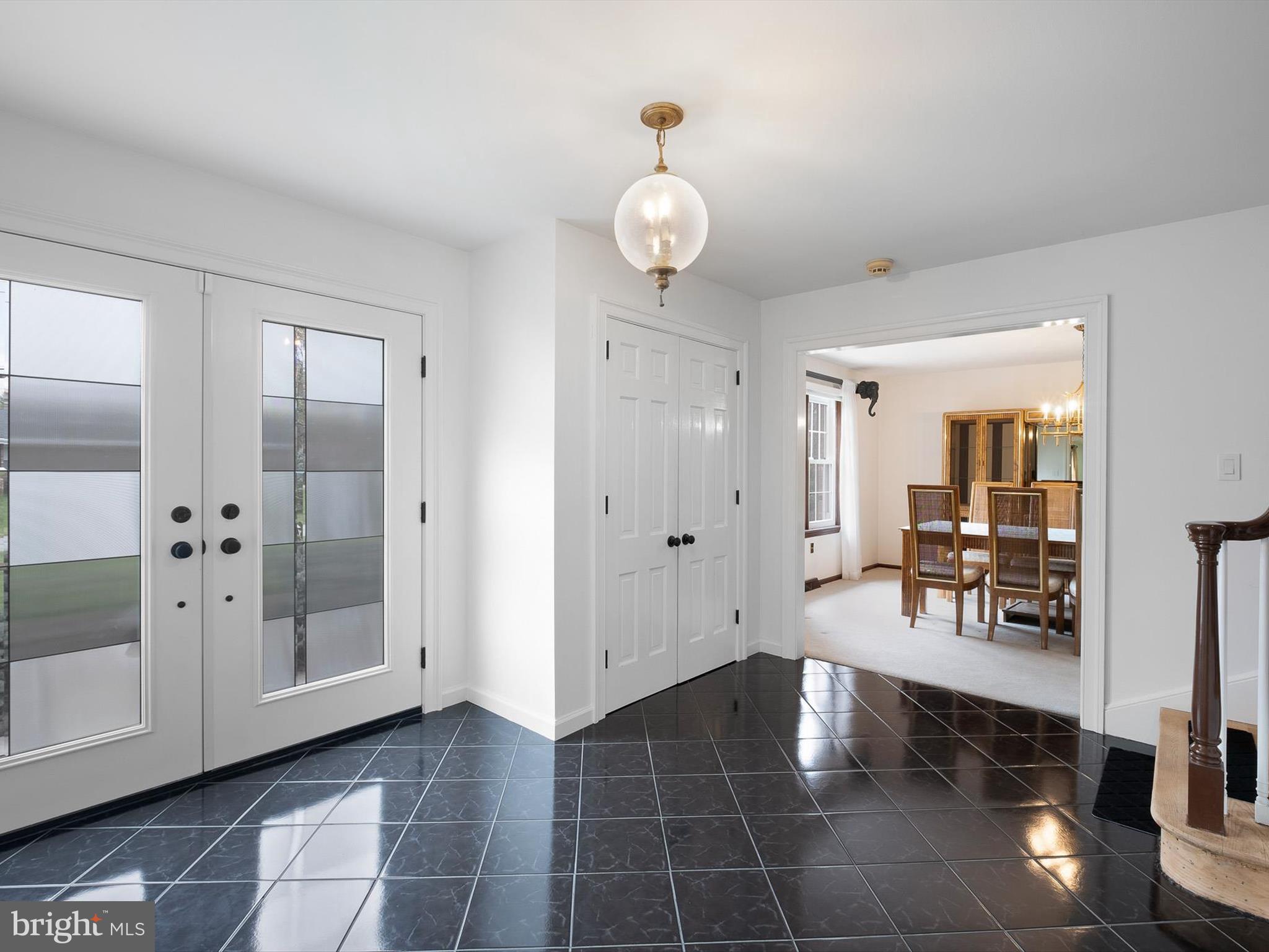 2 Windy Road Wilmington, DE 19810 - Photo 6 of 49 a hallway with dining area and chandelier