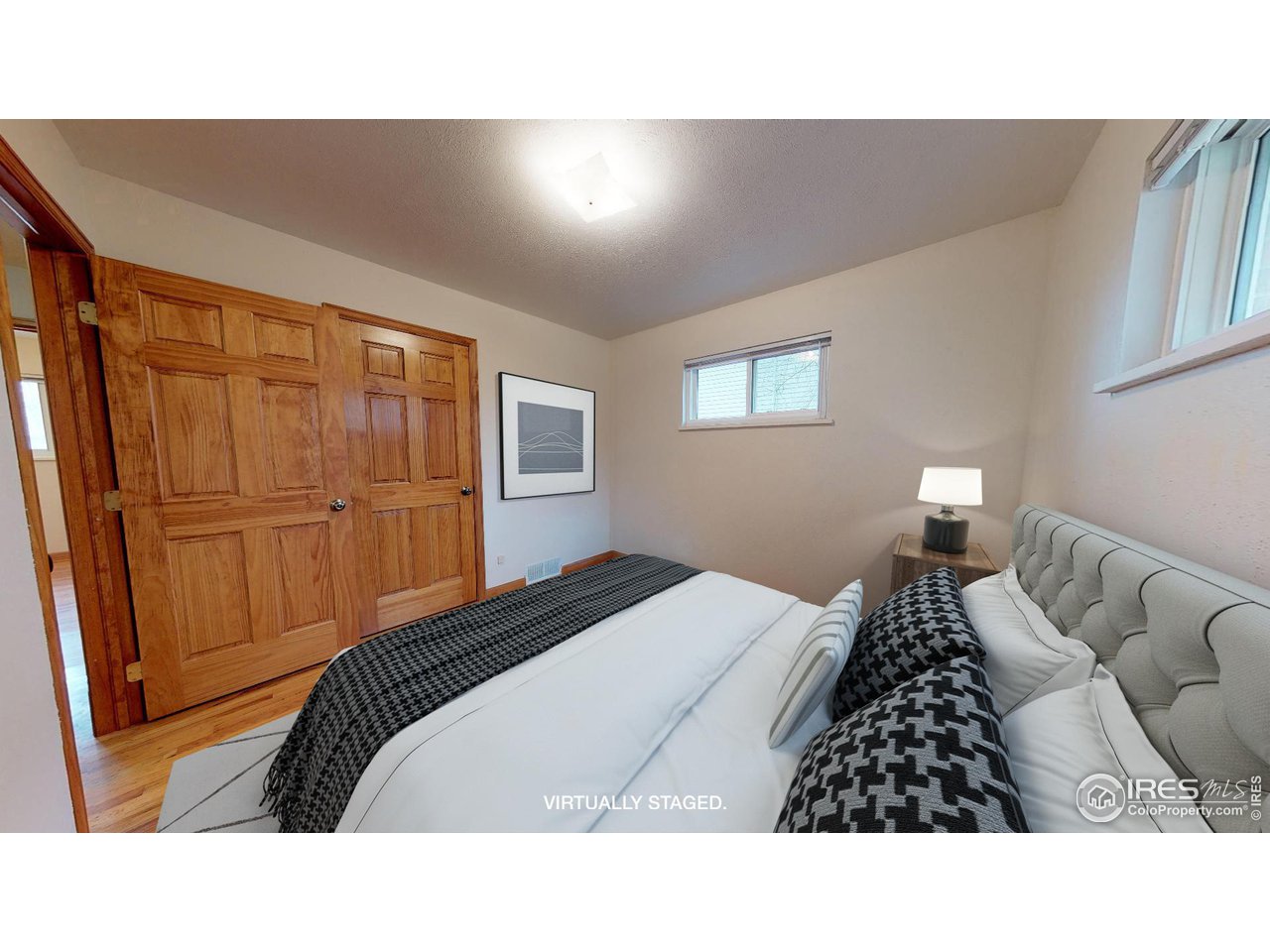 4480 Whitney Place Boulder, CO 80305 - Photo 11 of 17 a bedroom with a bed and with furniture