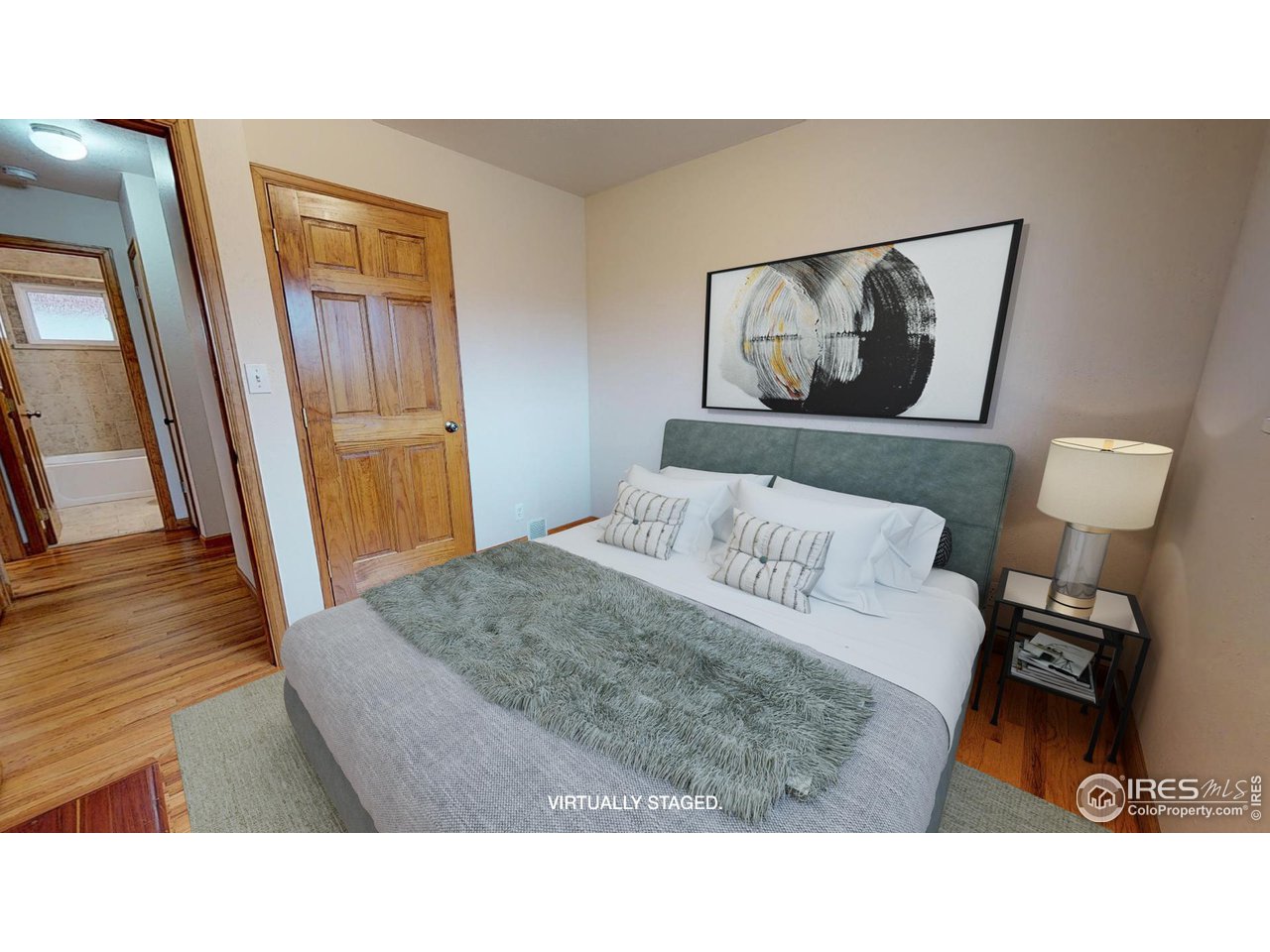 4480 Whitney Place Boulder, CO 80305 - Photo 12 of 17 a living room with a bed and a wooden floor