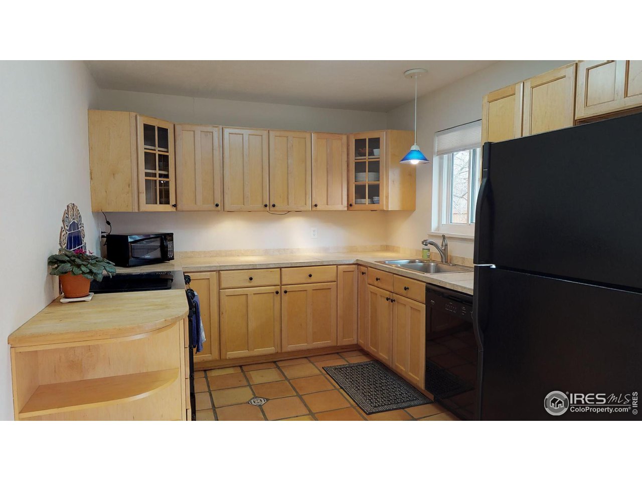 4480 Whitney Place Boulder, CO 80305 - Photo 16 of 17 a kitchen with a refrigerator and a stove
