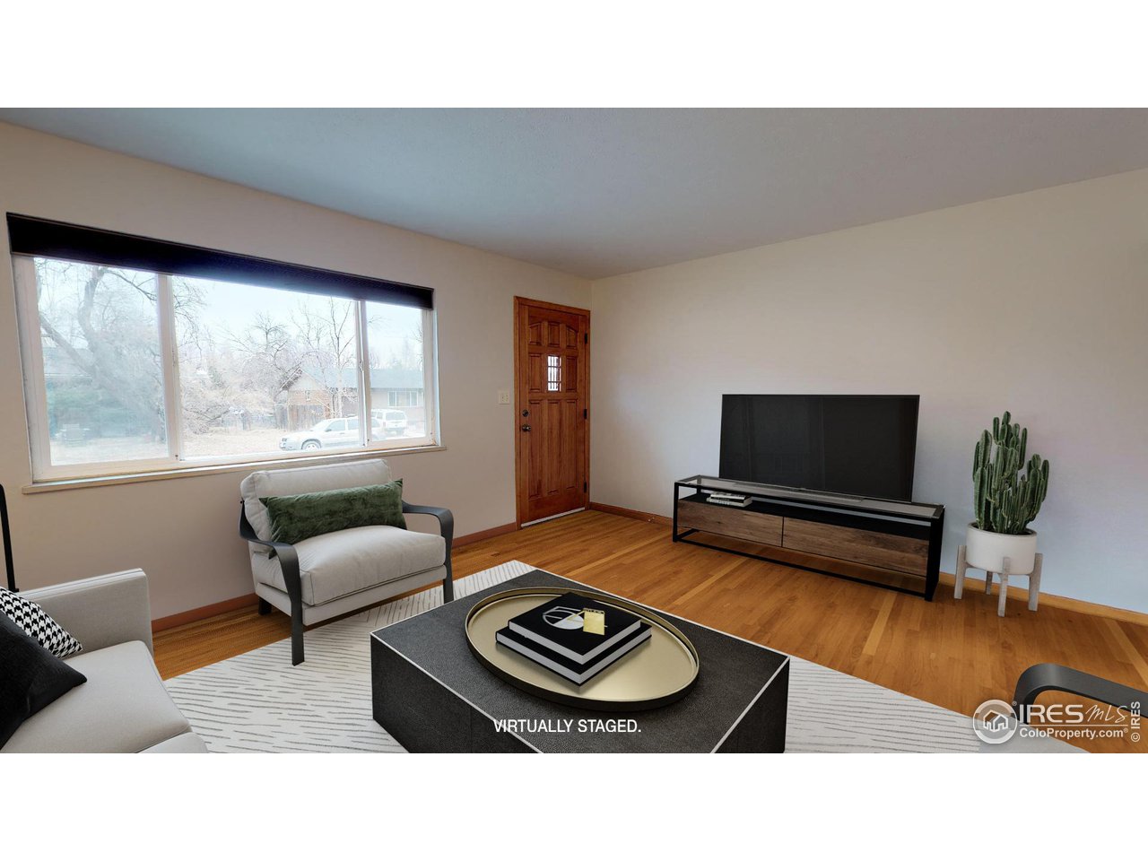 4480 Whitney Place Boulder, CO 80305 - Photo 2 of 17 a living room with furniture and a flat screen tv