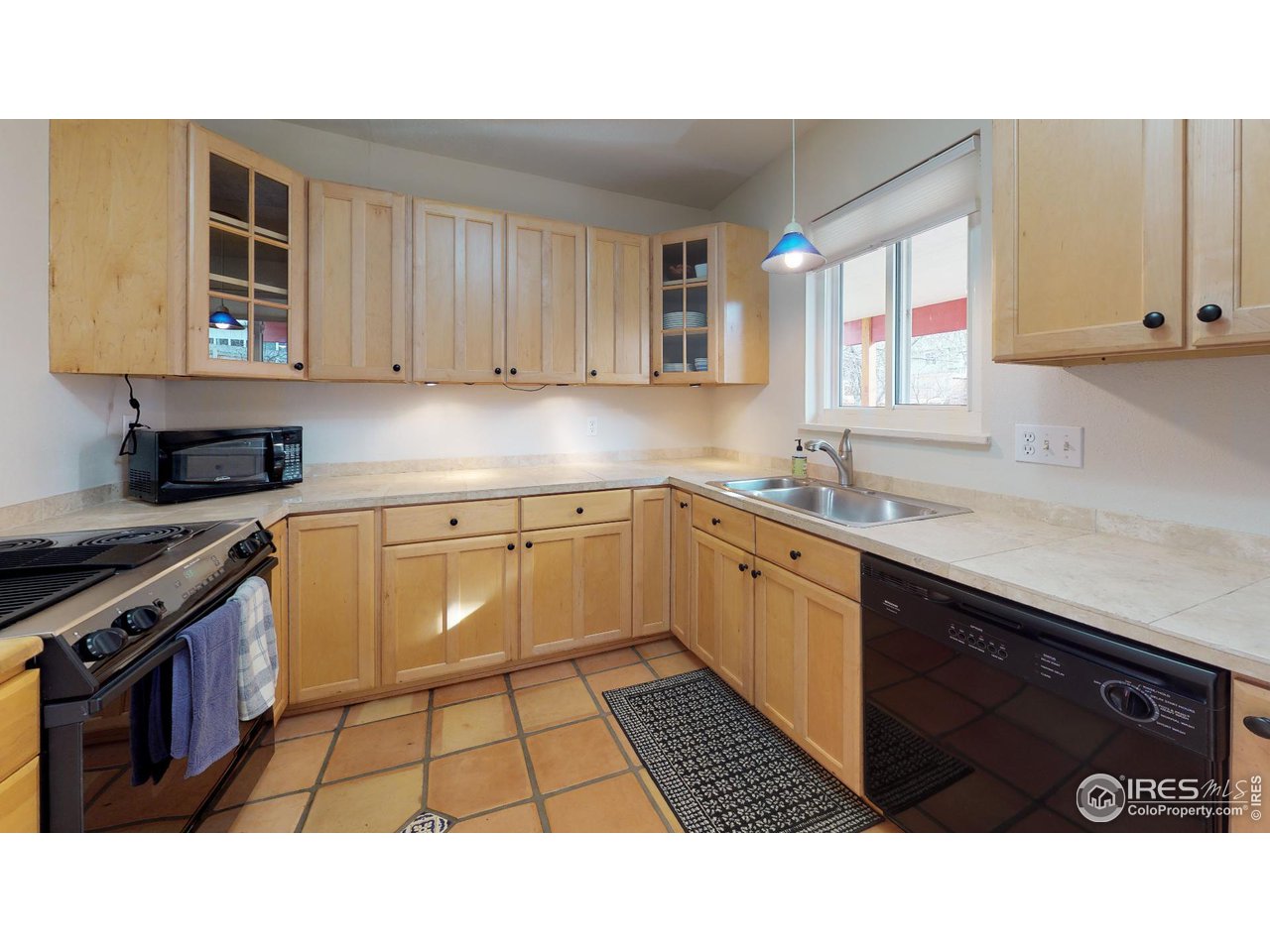4480 Whitney Place Boulder, CO 80305 - Photo 5 of 17 a kitchen with a sink cabinets and window