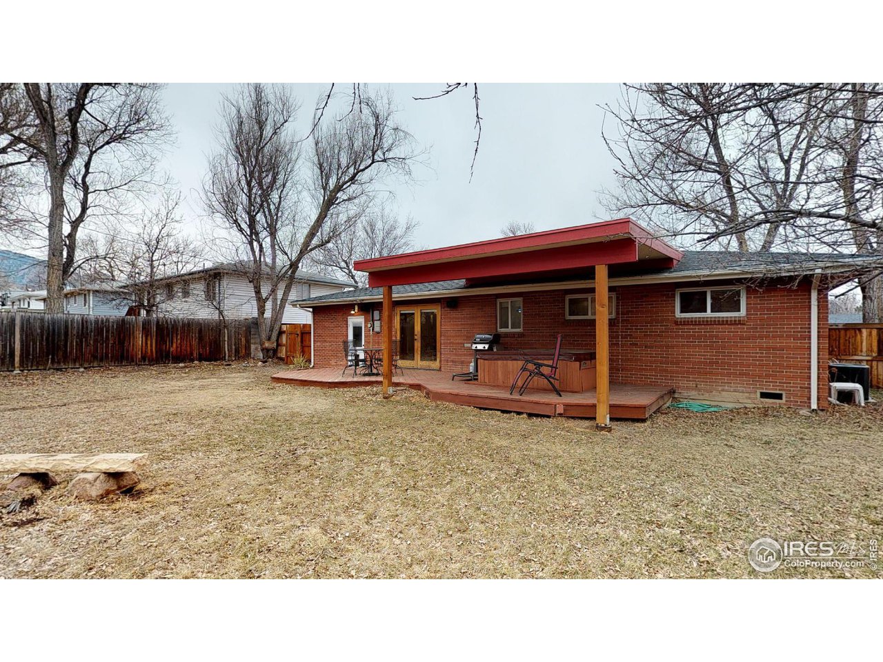 4480 Whitney Place Boulder, CO 80305 - Photo 7 of 17 a view of a house with a yard and sitting area