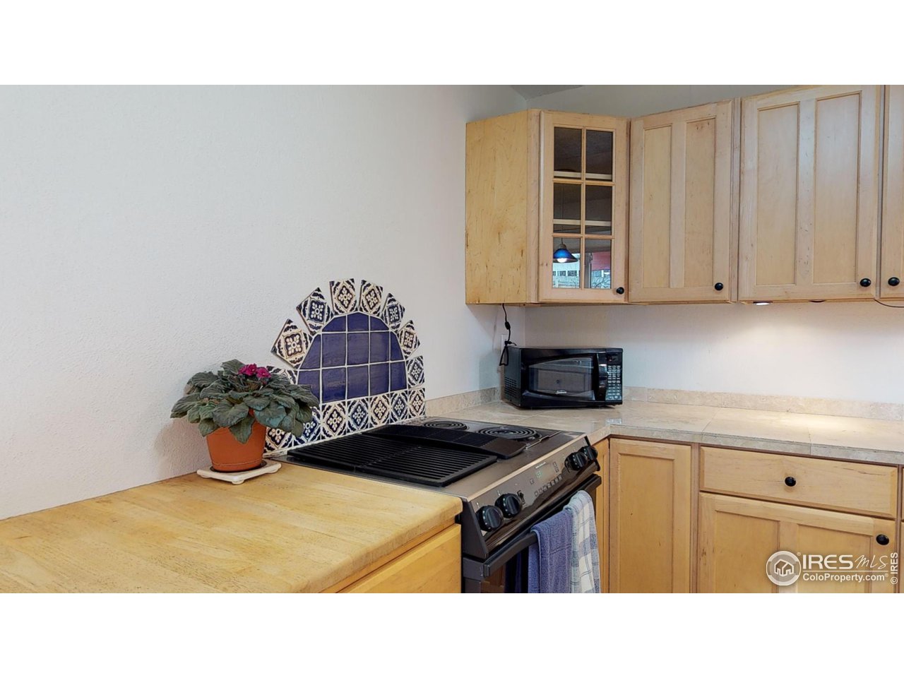 4480 Whitney Place Boulder, CO 80305 - Photo 8 of 17 a kitchen with a stove and a cabinet