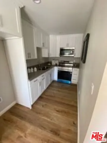 a kitchen with a stove and a microwave