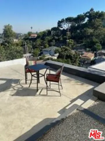 a view of a terrace with furniture