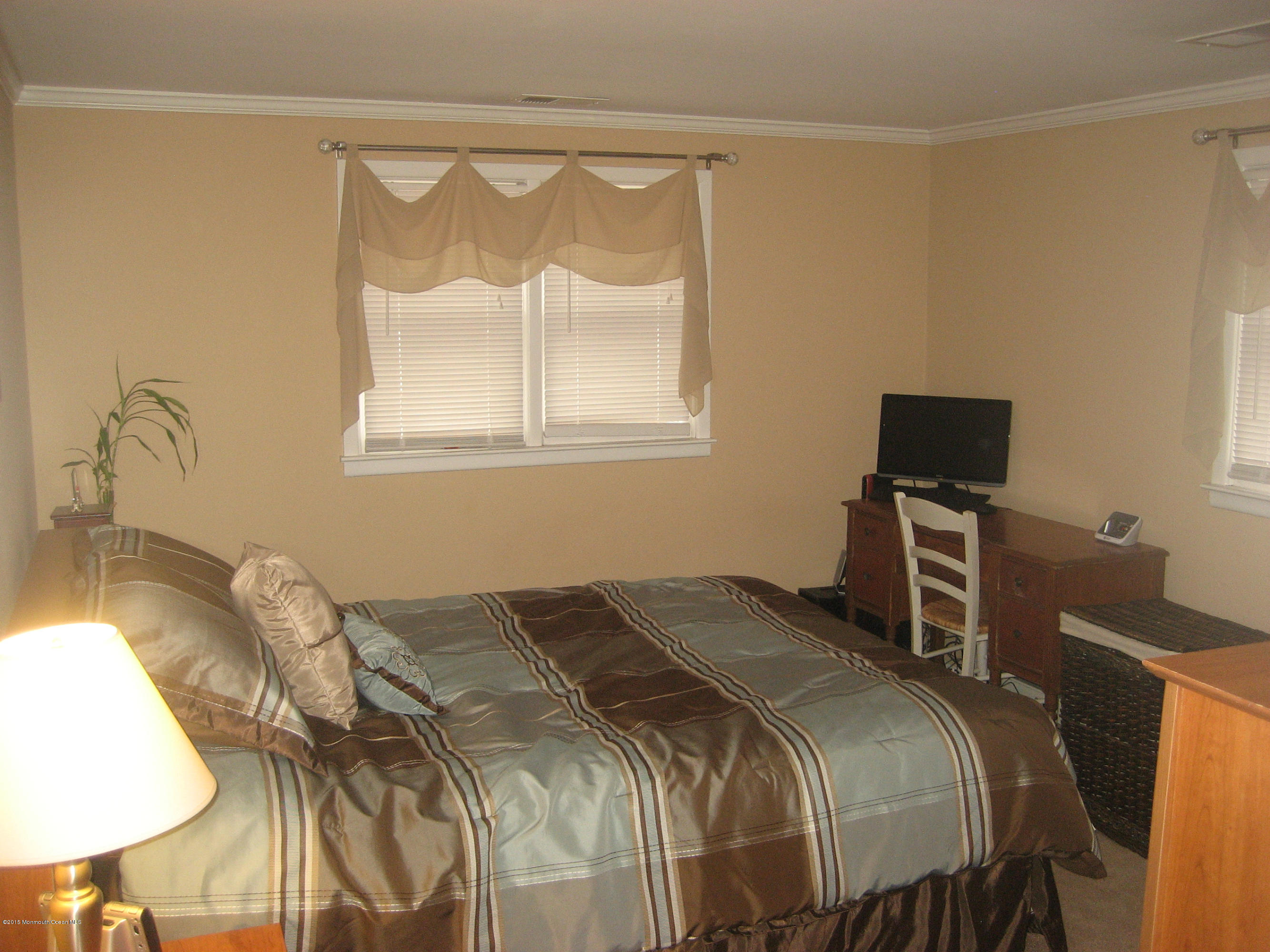 134 Club House Road Brick, NJ 08723 - Photo 10 of 20 a bedroom with a bed and a tv on the table