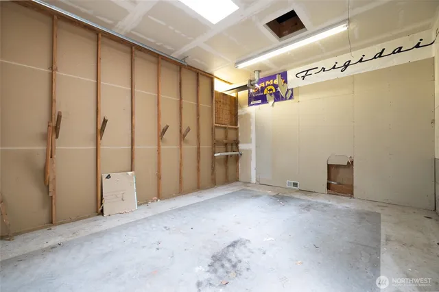 a kitchen with stainless steel appliances granite countertop a sink a refrigerator and a oven