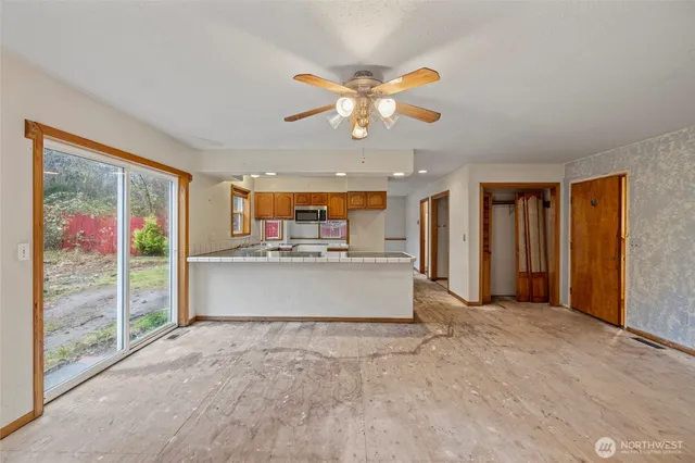 a view of kitchen with cabinets