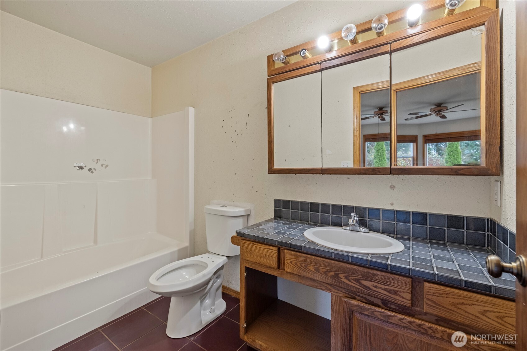 7308 Valley View Road Sedro-Woolley, WA 98284 - Photo 28 of 38 a bathroom with a sink a toilet and shower