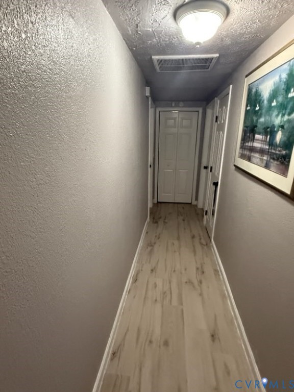 449 Colonial Trail West Dendron, VA 23839 - Photo 11 of 21 Hall way to living quarters and laundry room