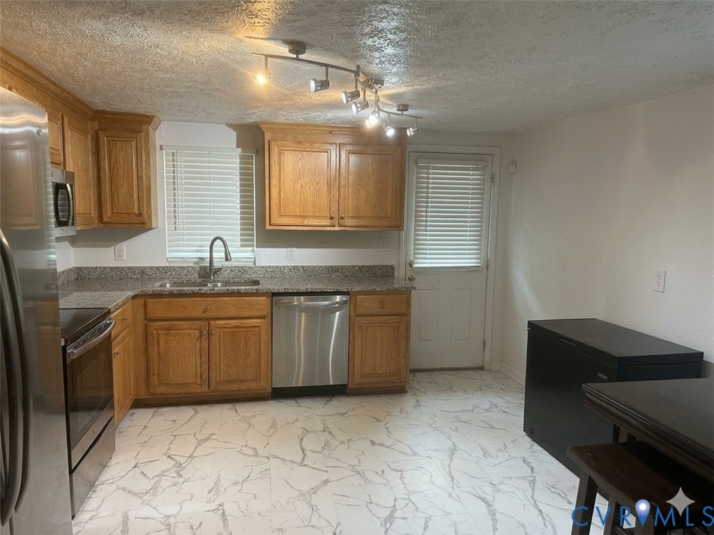 449 Colonial Trail West Dendron, VA 23839 - Photo 8 of 21 Updated Eat-In Kitchen with stainless steel appli
