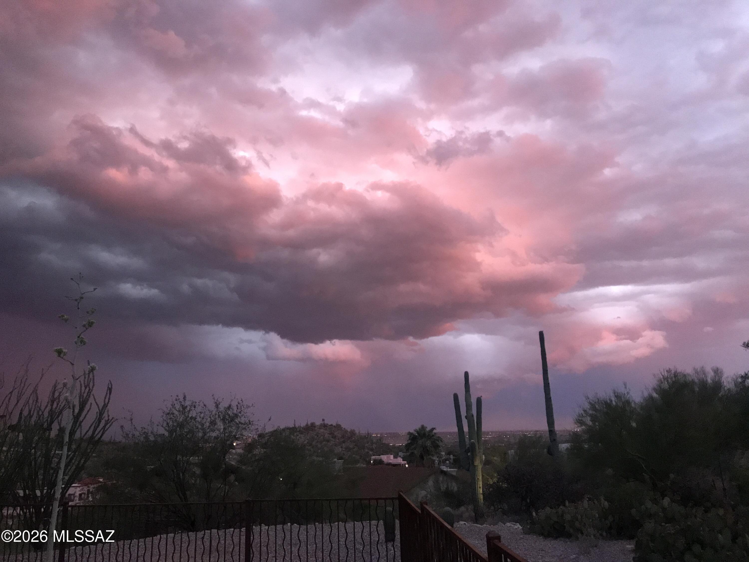 4641 North Rockcliff Road Tucson, AZ 85750 - Photo 40 of 48 Moody Sky from Rockcliff backyard. Photo by owner.
