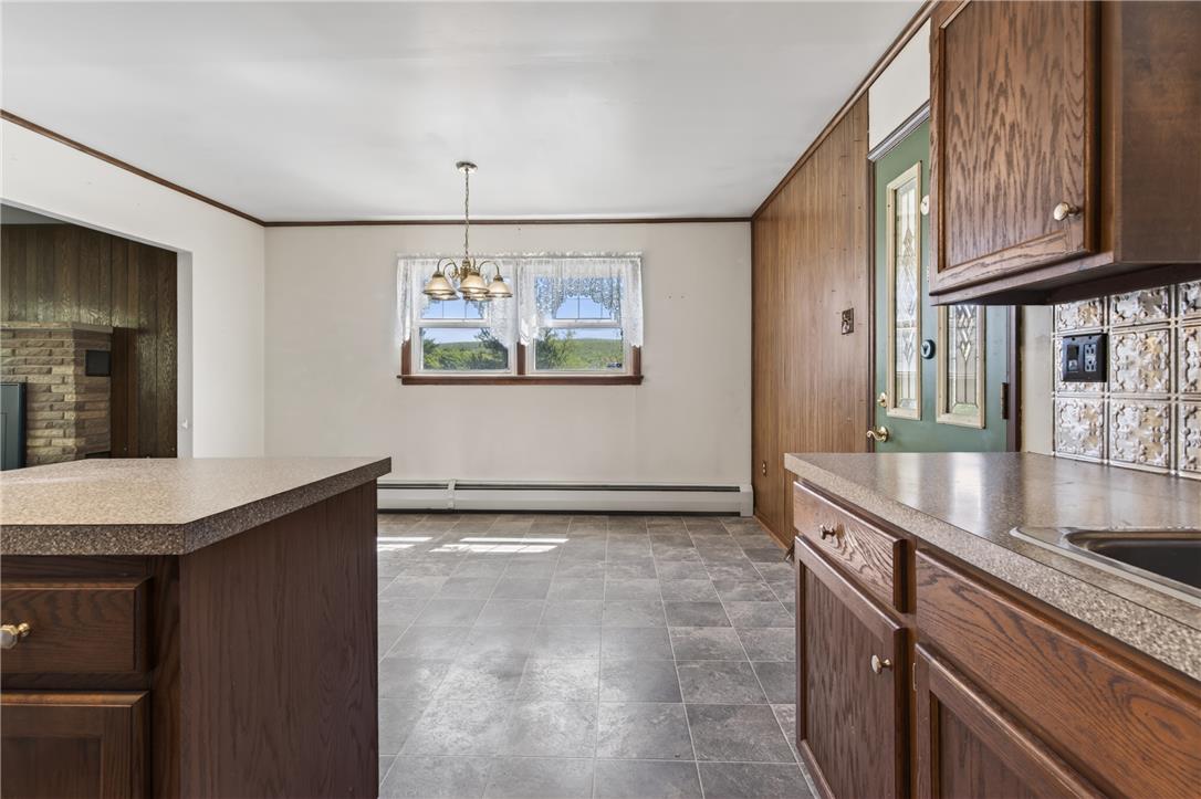62 Stoney Road Tamaqua, PA 18252 - Photo 20 of 61 A well-lit eat-in kitchen with tiled floors and ample counter space.