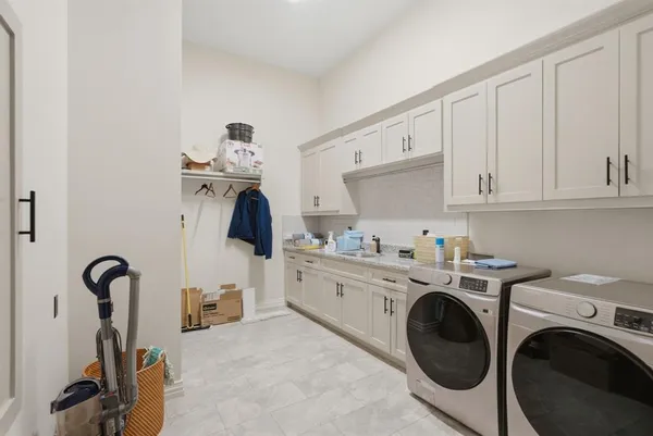 a view of a kitchen with sink dryer and washer