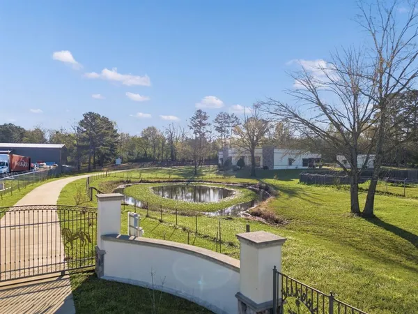 a view of swimming pool with a patio and a yard