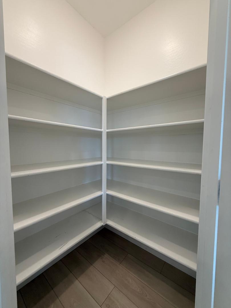 17760 West Cassia Way Goodyear, AZ 85338 - Photo 13 of 37 a view of walk in closet with empty racks