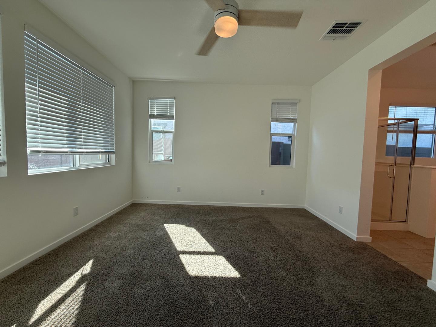 17760 West Cassia Way Goodyear, AZ 85338 - Photo 19 of 37 an empty room with windows