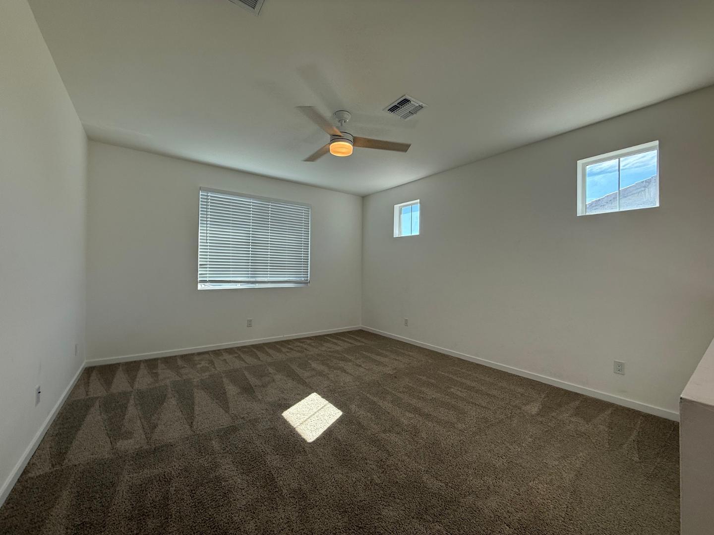 17760 West Cassia Way Goodyear, AZ 85338 - Photo 27 of 37 an empty room with a window
