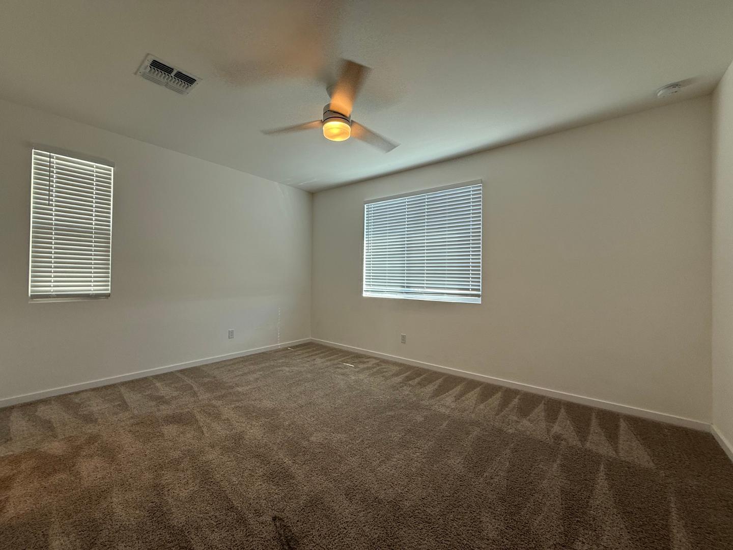 17760 West Cassia Way Goodyear, AZ 85338 - Photo 28 of 37 a view of an empty room with a window