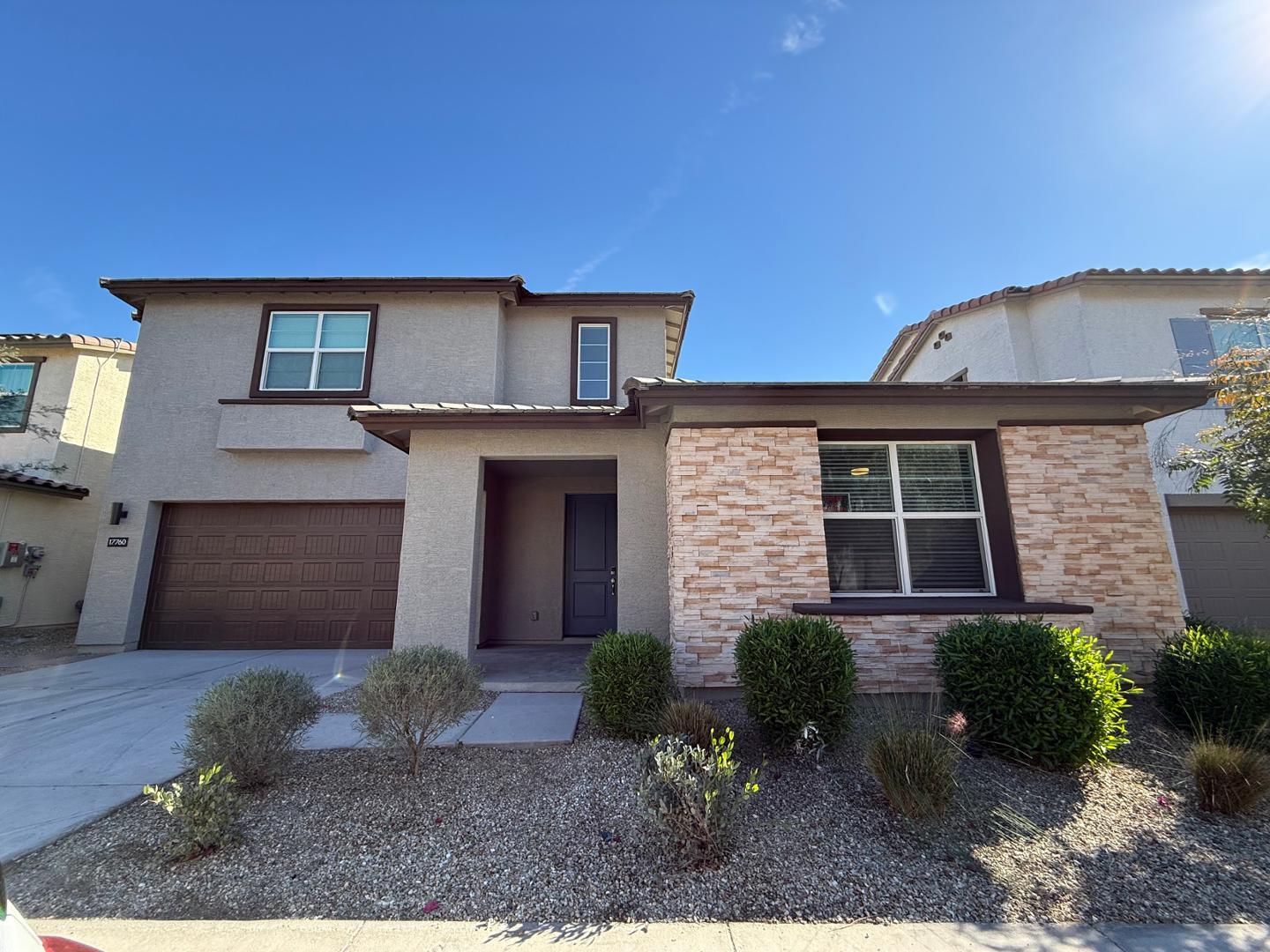 17760 West Cassia Way Goodyear, AZ 85338 - Photo 3 of 37 a front view of a house with garden