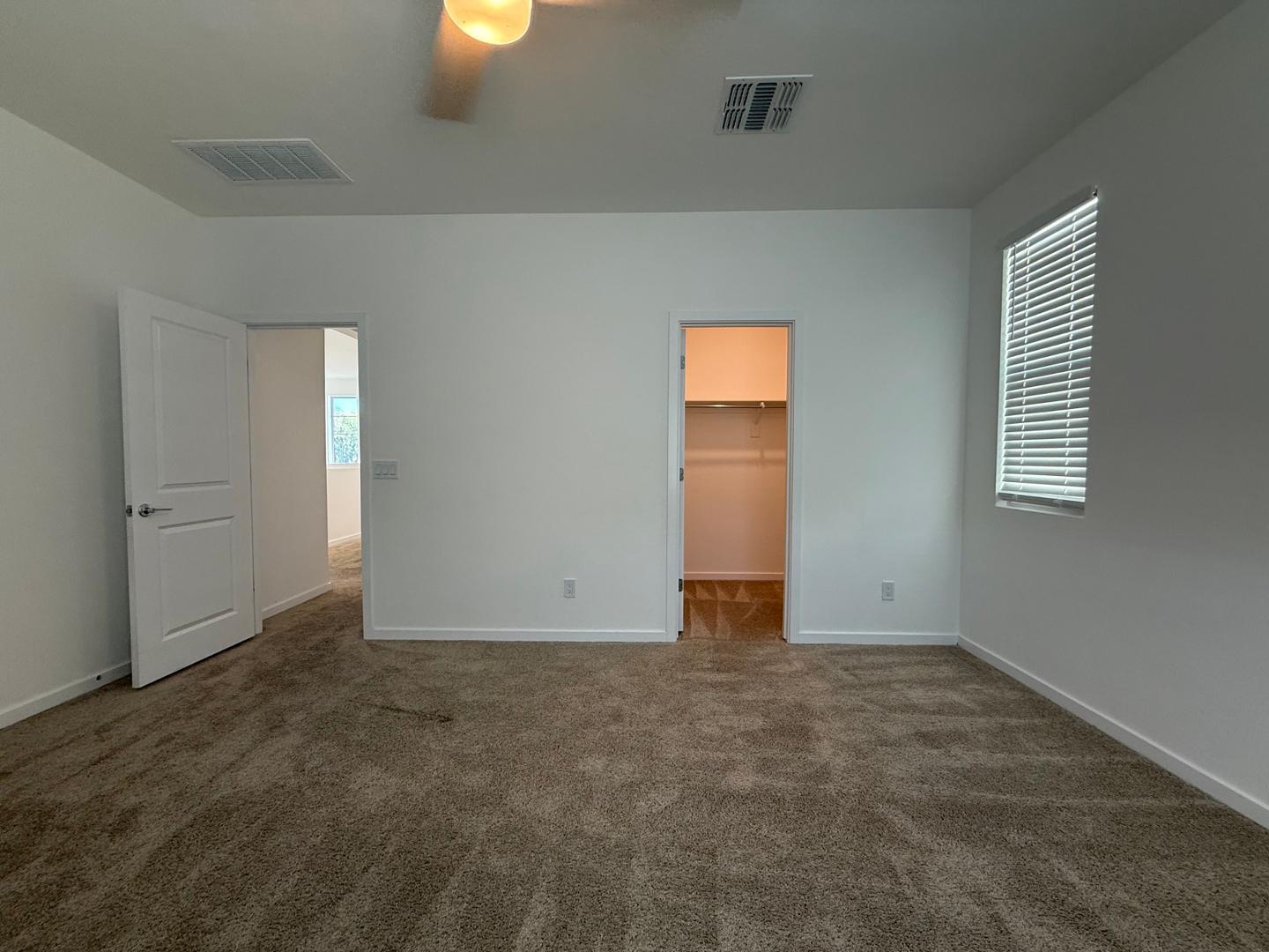 17760 West Cassia Way Goodyear, AZ 85338 - Photo 32 of 37 an empty room with windows