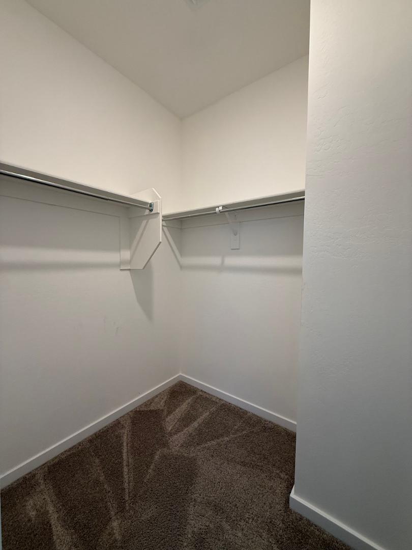 17760 West Cassia Way Goodyear, AZ 85338 - Photo 35 of 37 a view of small space with racks on the wall