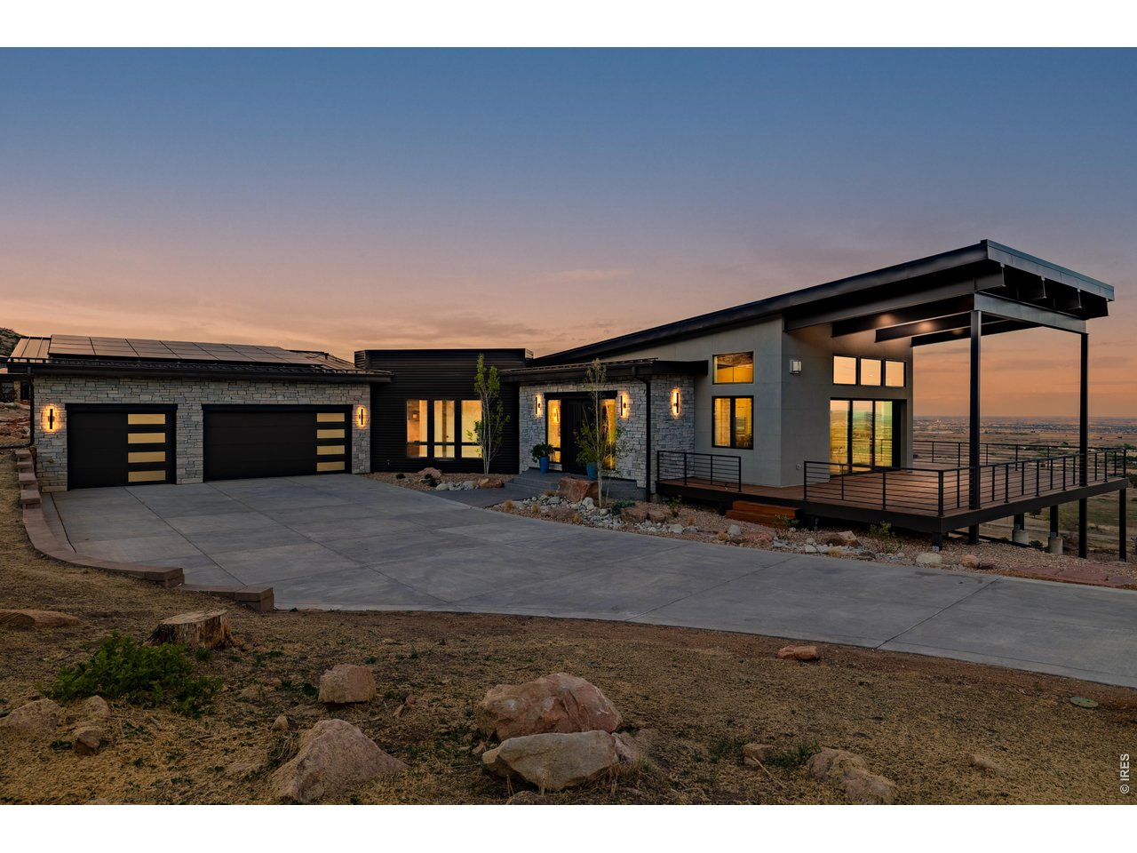 a view of a house with a yard and garage