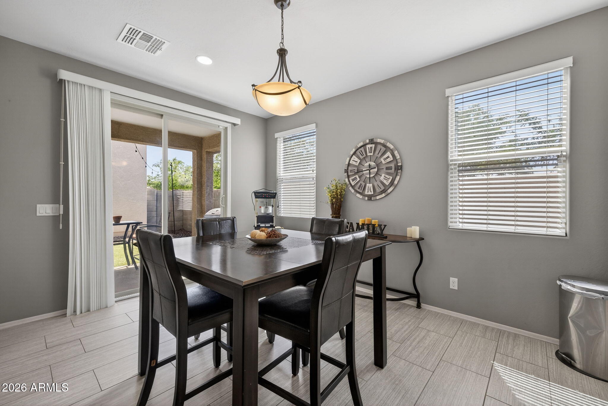 921 South Swallow Lane Gilbert, AZ 85296 - Photo 14 of 36 a view of a dining room with furniture window and outside view