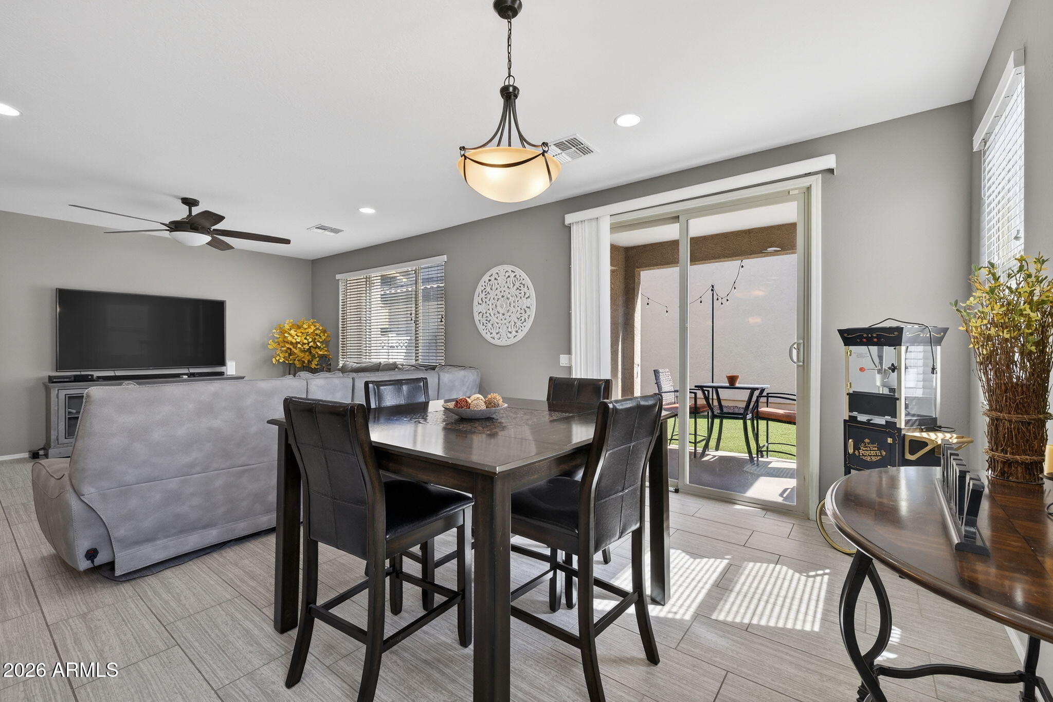 921 South Swallow Lane Gilbert, AZ 85296 - Photo 15 of 36 a view of a dining room with furniture and a chandelier