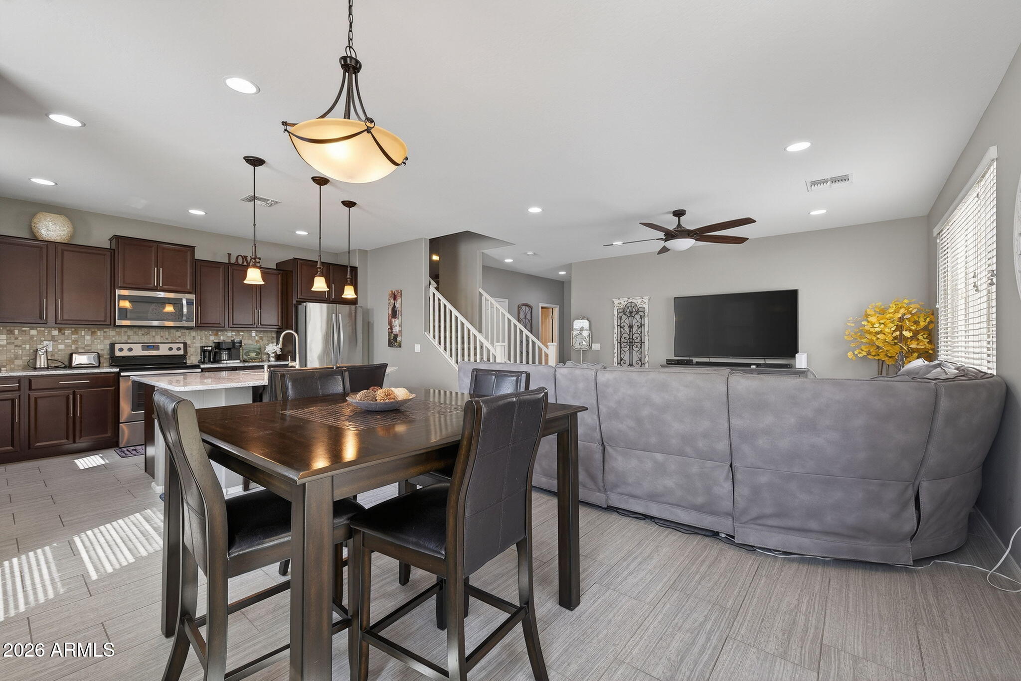 921 South Swallow Lane Gilbert, AZ 85296 - Photo 16 of 36 a living room with furniture and kitchen view