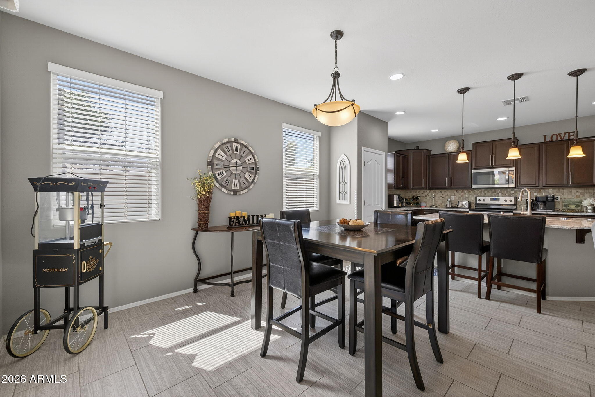 921 South Swallow Lane Gilbert, AZ 85296 - Photo 17 of 36 a view of a dining room and livingroom