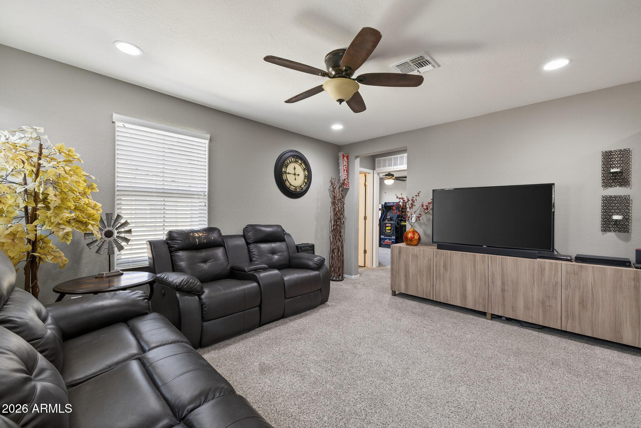 921 South Swallow Lane Gilbert, AZ 85296 - Photo 18 of 36 a living room with furniture and a flat screen tv